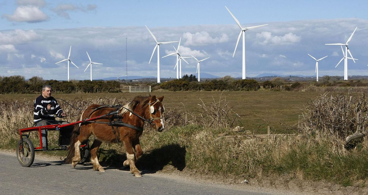 805955254 Billy Collins from Wexford town rides his Sulky past a field of Wind Turbines in Kilmore Co Wexford.   (Photo by Niall Carson/PA Images via Getty Images)