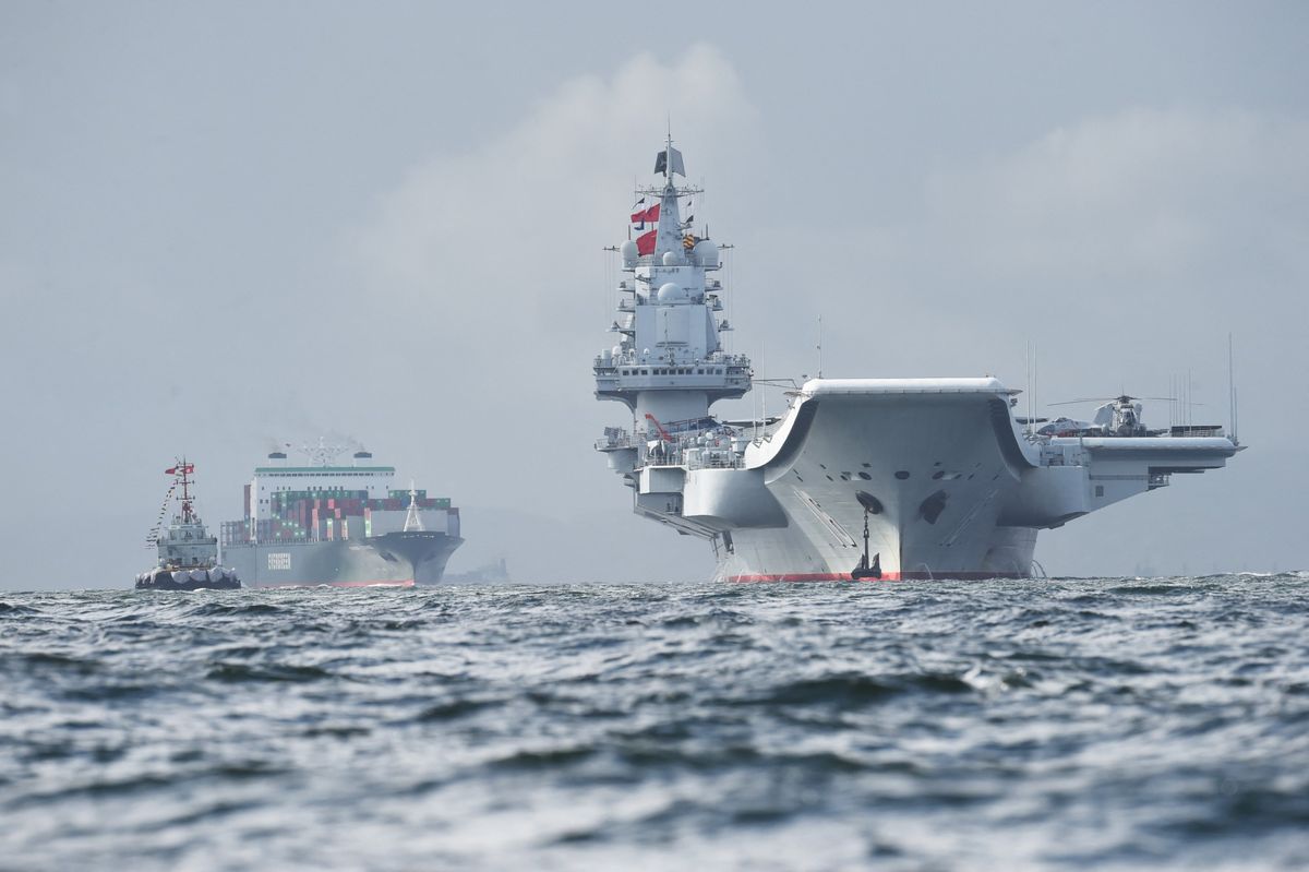 China's sole aircraft carrier, the Liaoning (R), arrives in Hong Kong waters on July 7, 2017, less than a week after a high-profile visit by president Xi Jinping. China's national defence ministry had said the Liaoning, named after a northeastern Chinese province, was part of a flotilla on a "routine training mission" and would make a port of call in the former British colony.
Anthony WALLACE / AFP