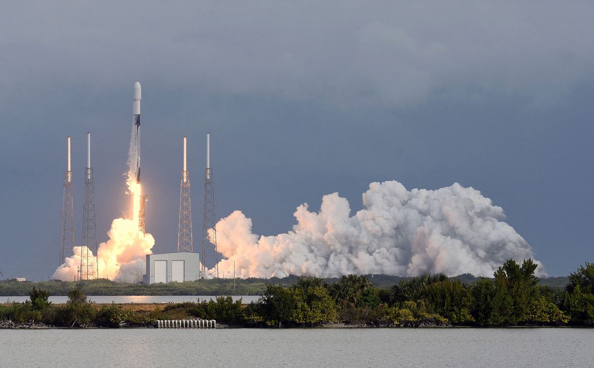 A SpaceX Falcon 9 rocket lifts off from pad 40 at Cape Canaveral Space Force Station on January 24, 2021 in Cape Canaveral, Florida. The Transporter-1 mission is the first in a planned series of small satellite rideshare missions that will take 143 U.S. and international spacecraft, including 10 Starlink satellites, to low earth orbit, a record number of satellites on a single flight. (Photo by Paul Hennessy/NurPhoto) (Photo by Paul Hennessy / NurPhoto / NurPhoto via AFP)