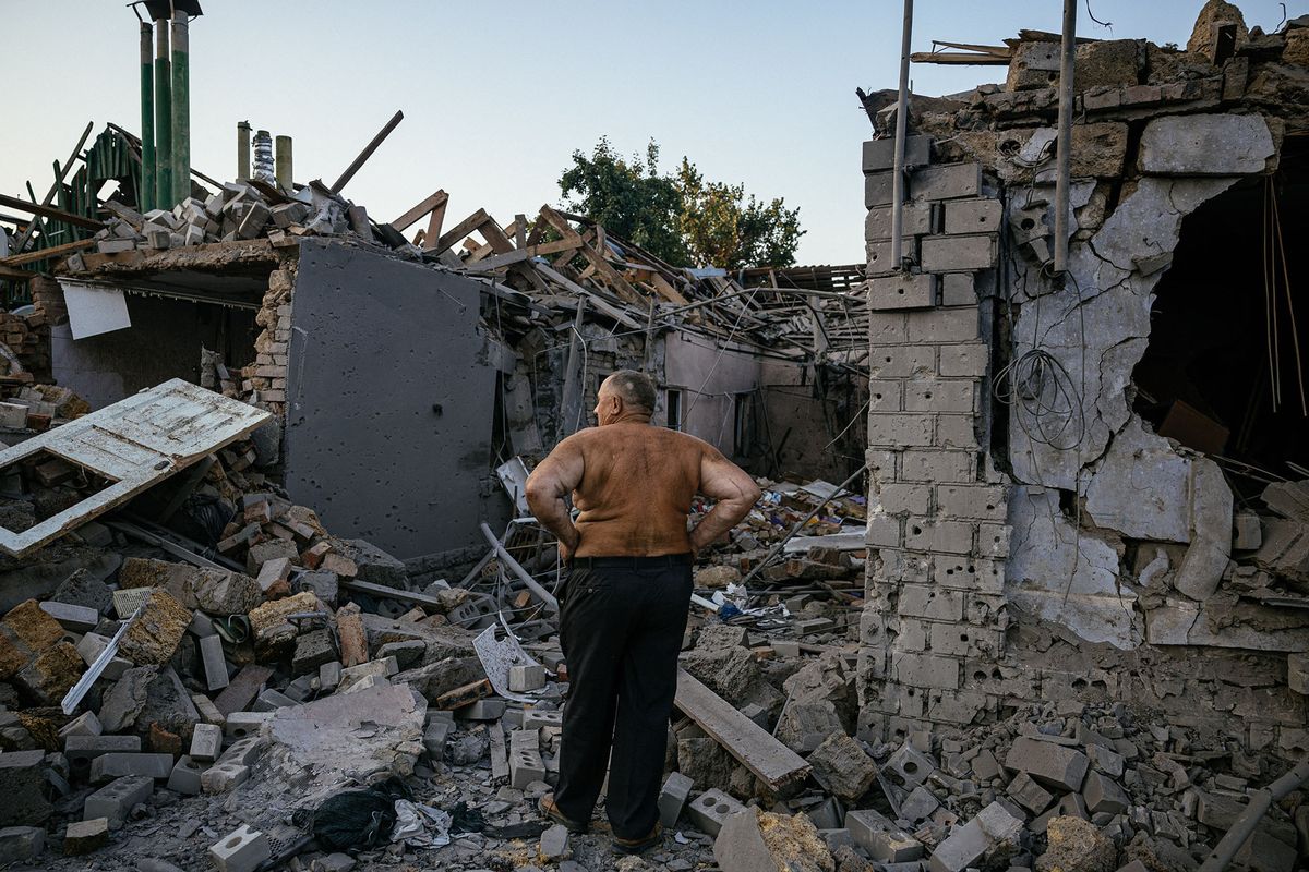 Oleksandr Shulga looks at his destroyed house following a missile strike in Mykolaiv on August 29, 2022, amid the Russian invasion of Ukraine. - Ukrainian forces have begun a counter-attack to retake the southern city of Kherson, which is currently occupied by Russian troops, a local government official said on Monday. (Photo by Dimitar DILKOFF / AFP)