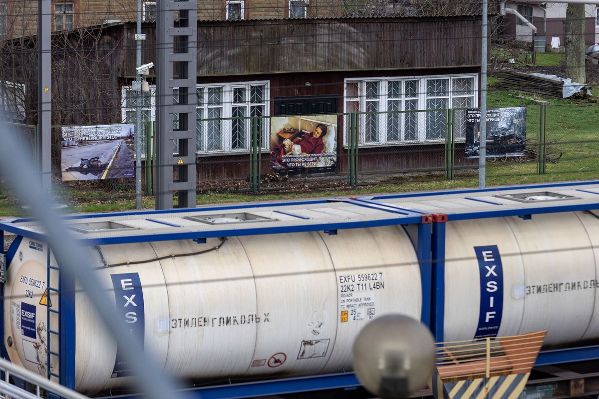 1393813520 KALVELIAI, LITHUANIA - APRIL 26: Photographs of Russia's war in Ukraine are displayed as part of an exhibition at the railway station where train from Moscow to Kaliningrad passes by on April 26, 2022 in Kalveliai, Lithuania. Russia invaded neighbouring Ukraine on February 24, 2022, and has been met with worldwide condemnation in the form of rallies, protests and peace marches taking place in cities across the globe. (Photo by Paulius Peleckis/Getty Images)