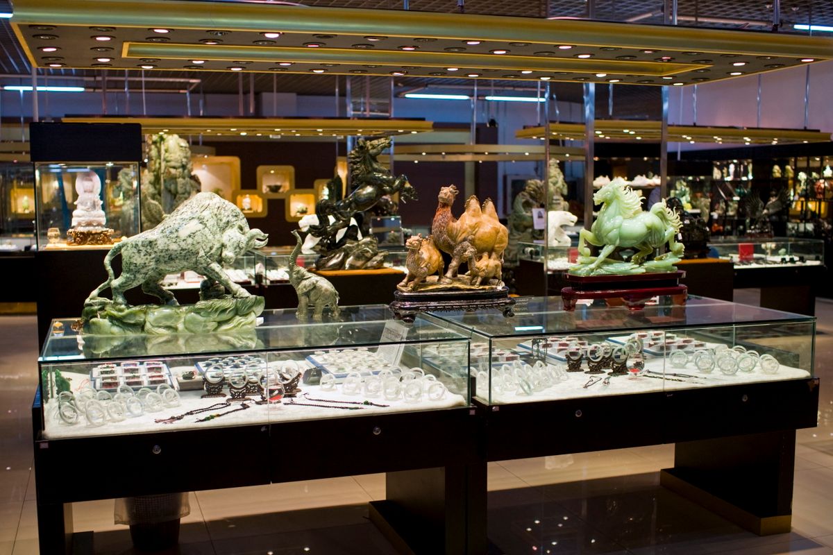 Jade items on display in the Beijing Dragon Land gallery in Beijing, China (Photo by TIM GRAHAM / Robert Harding Heritage / robertharding via AFP)
