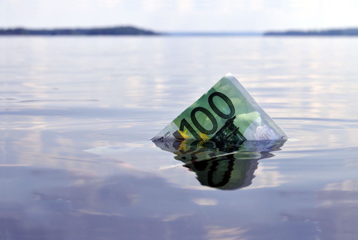 100-euro,Note,Sinking,Into,The,Water,,Shot,On,A,Lake
