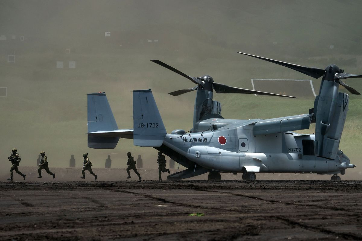 1399678236 GOTEMBA, JAPAN - MAY 28: Members of the Japan Ground Self-Defense Force (JGSDF) disembark from a V-22 Osprey aircraft during a live fire exercise at East Fuji Maneuver Area on May 28, 2022 in Gotemba, Shizuoka, Japan. The annual live-fire drill takes place as Japanese Prime Minister Fumio Kishida pledged to boost defense spending after a summit with U.S. President Joe Biden and other "Quad" leaders this week.  (Photo by Tomohiro Ohsumi/Getty Images)
