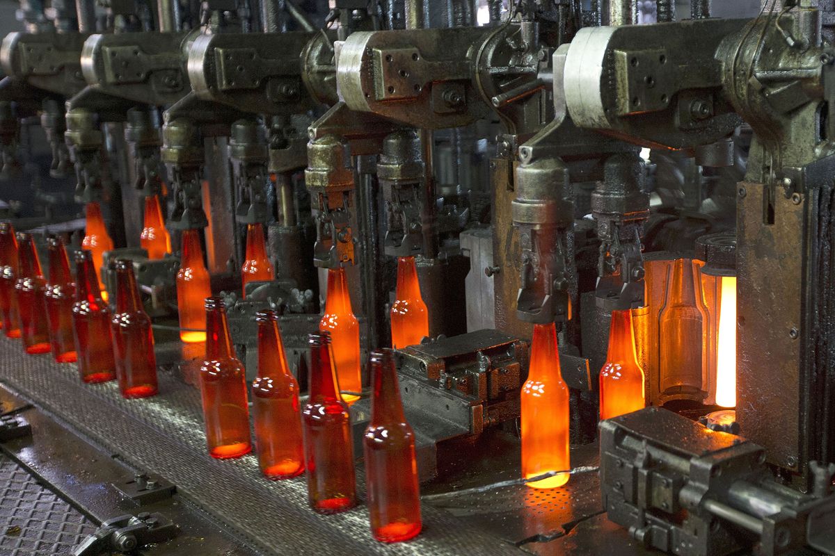 Bottles are seen on the production line of Phoenicia Glass Works Ltd factory on December 31, 2012  in the southern city of Yerukham south of Beer Sheva. AFP PHOTO / JACK GUEZ (Photo by JACK GUEZ / AFP)