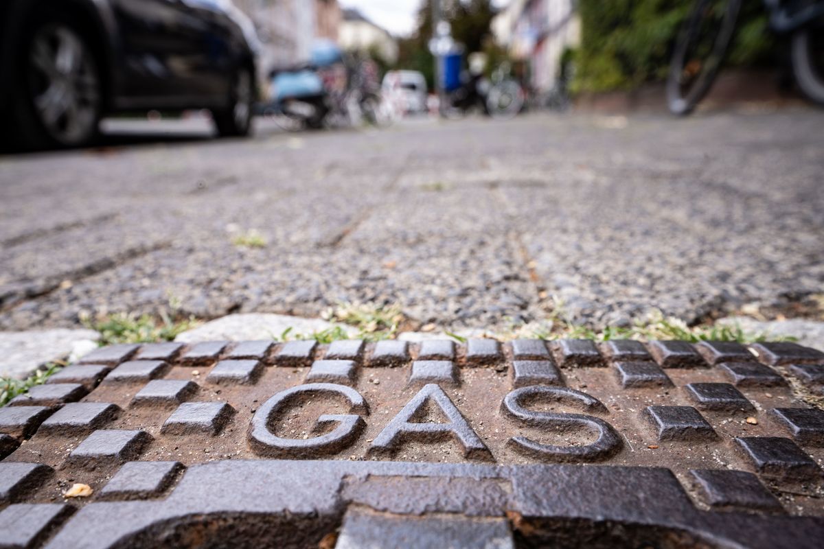 26 July 2022, Hessen, Frankfurt/Main: The word "gas" is written on a cast iron lid that sits on a sidewalk above a gas line that runs underneath. Photo: Frank Rumpenhorst/dpa (Photo by Frank Rumpenhorst/picture alliance via Getty Images)