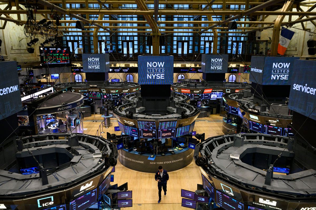 Traders work on the floor of the New York Stock Exchange (NYSE) at the opening bell on August 5, 2022 at Wall Street in New York City. - Stock markets slid Friday as a much stronger-than-expected US jobs report raised the prospect that the Federal Reserve will maintain its aggressive monetary policy to combat inflation. (Photo by ANGELA WEISS / AFP)