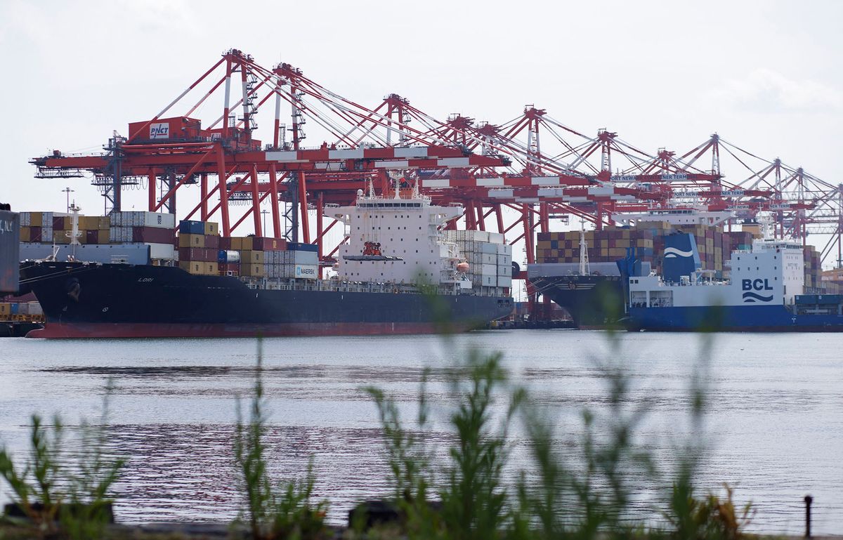 Cargo ships are docked at the Port Newark Container Terminal in Newark, New Jersey, on July 21, 2022. (Photo by KENA BETANCUR / AFP)