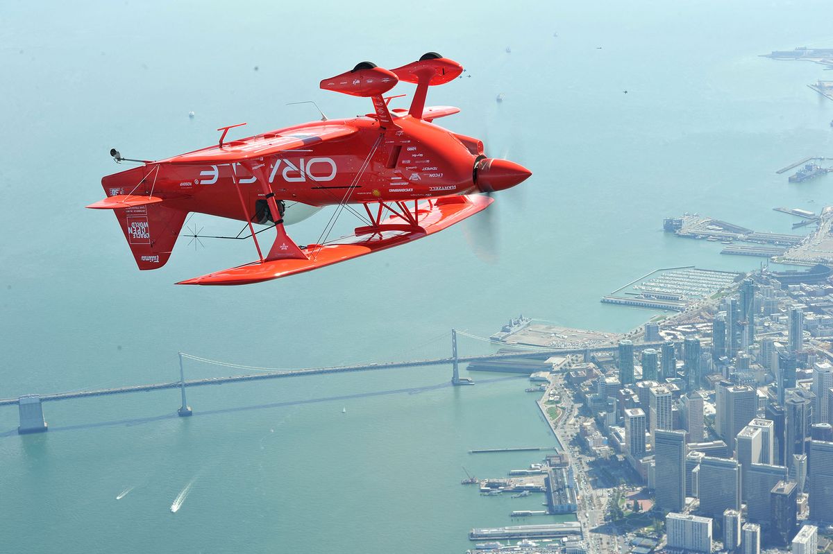 Team Oracle stunt pilot Sean Tucker flies upside down as part of a practice run for Fleet Week in San Francisco, California on October 8, 2015. Fleet Week started on October 5 and goes till October 12 and will include ship tours and an air show.AFP PHOTO/JOSH EDELSON (Photo by Josh Edelson / AFP)