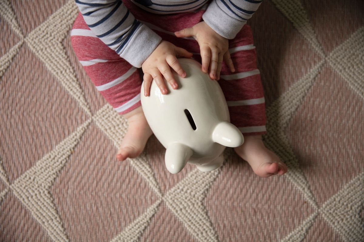 Financial,Planning.,Baby,With,A,Piggy,Bank,Investing,For,Their