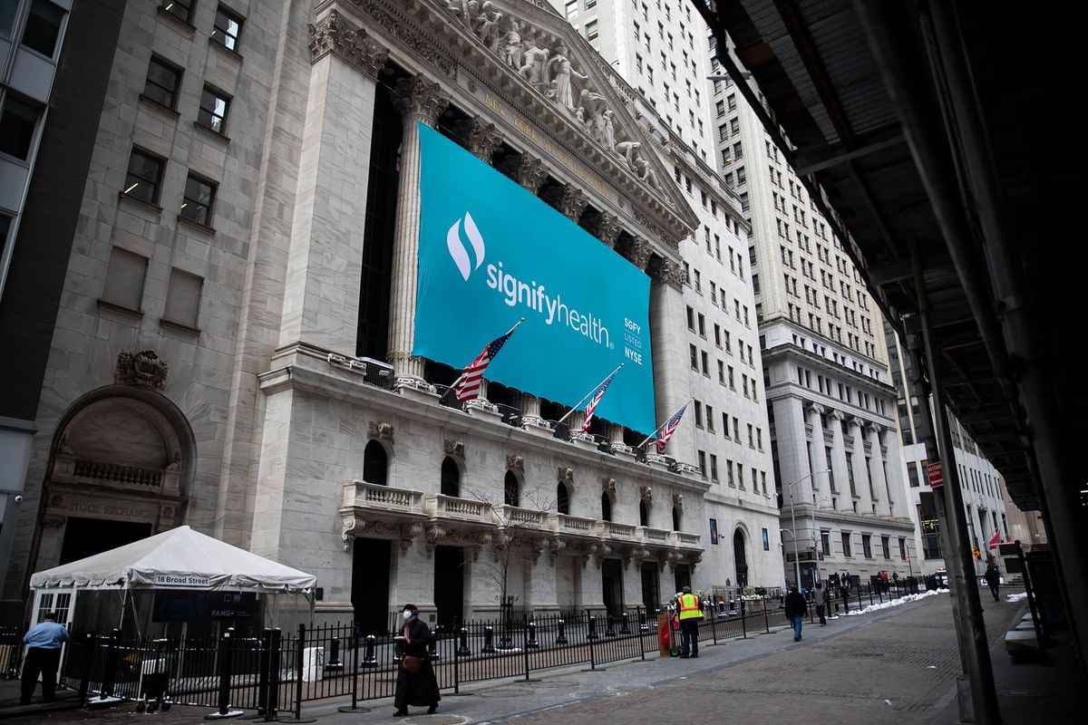 1231105759 Signify Health Inc. signage hangs outside the New York Stock Exchange (NYSE) during the company's initial public offering (IPO) in New York, U.S., on Thursday, Feb. 11, 2021. Signify Health Inc. opened trading at $32 after its $564 million IPO priced at $24 per share, above its $20 to $21 offering range. Photographer: Michael Nagle/Bloomberg via Getty Images