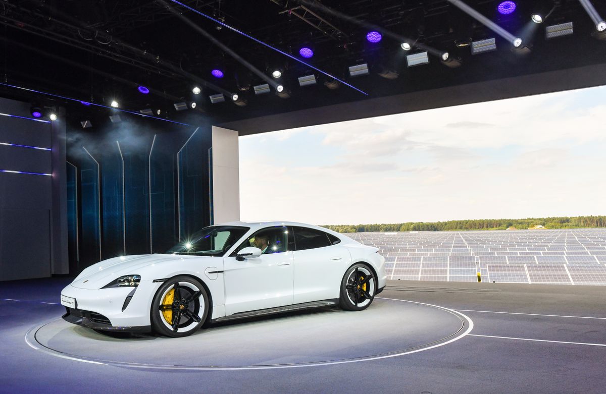 World premiere of the Porsche Taycan, 04 September 2019, Brandenburg, Neuhardenberg: The Porsche Taycan will be presented to the public for the first time at the world premiere of the automobile group in a hall in front of a photovoltaic power plant at the airport in Neuhardenberg. On Wednesday, the first purely electric model from Stuttgart-Zuffenhausen will celebrate its world premiere simultaneously on three continents. It will be delivered at the end of the year, the USA will make the start. The expectations are high. Porsche, like the industry as a whole, has been criticised for the diesel scandal and the debate about driving bans and is viewed with skepticism. Photo: Patrick Pleul/dpa-Zentralbild/dpa (Photo by Patrick Pleul/picture alliance via Getty Images)