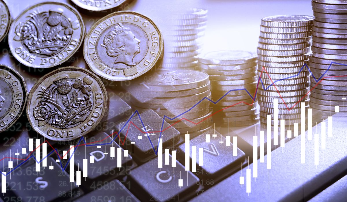 Double,Exposure,Of,Uk,Stock,Graphic,With,Keyboard,New,Pound, Double exposure of UK Stock graphic with keyboard new pound coin background on financial market trade chart, finance and banking concept. Mixed media.