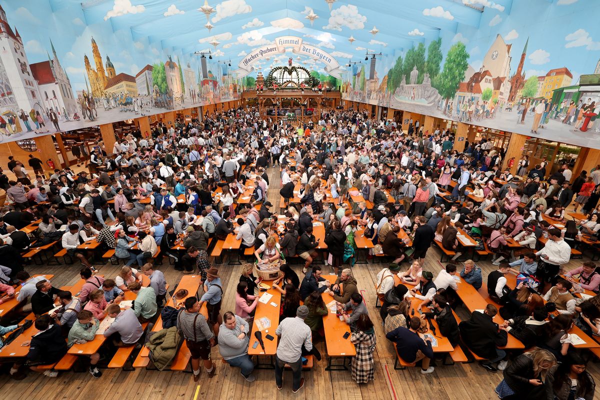 Oktoberfest 2022: Opening Day, MUNICH, GERMANY - SEPTEMBER 17: Revelers are pictured at the Hacker Pschorr tent to wait for the official opening on the first day of the 2022 Oktoberfest beer fest on September 17, 2022 in Munich, Germany. This year's Oktoberfest, which runs until October 3 and is expected to draw over a million visitors, is the first to take place since 2019. The past two years were closed down due to the coronavirus pandemic. (Photo by Alexandra Beier/Getty Images)