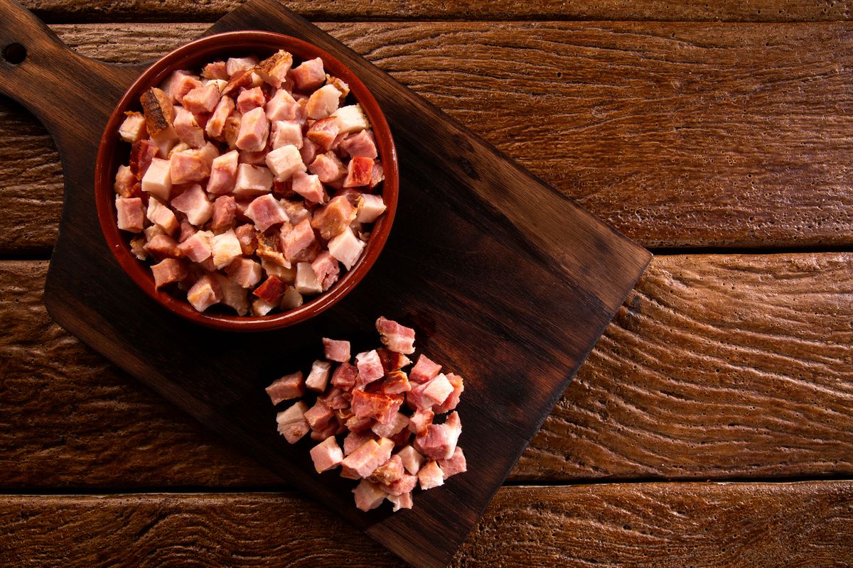 Closeup,Of,Cubes,Of,Bacon,On,A,Rustic,Wooden,Board. closeup of cubes of bacon on a rustic wooden board. Raw. closeup of cubes of bacon on a rustic wooden board. Raw.