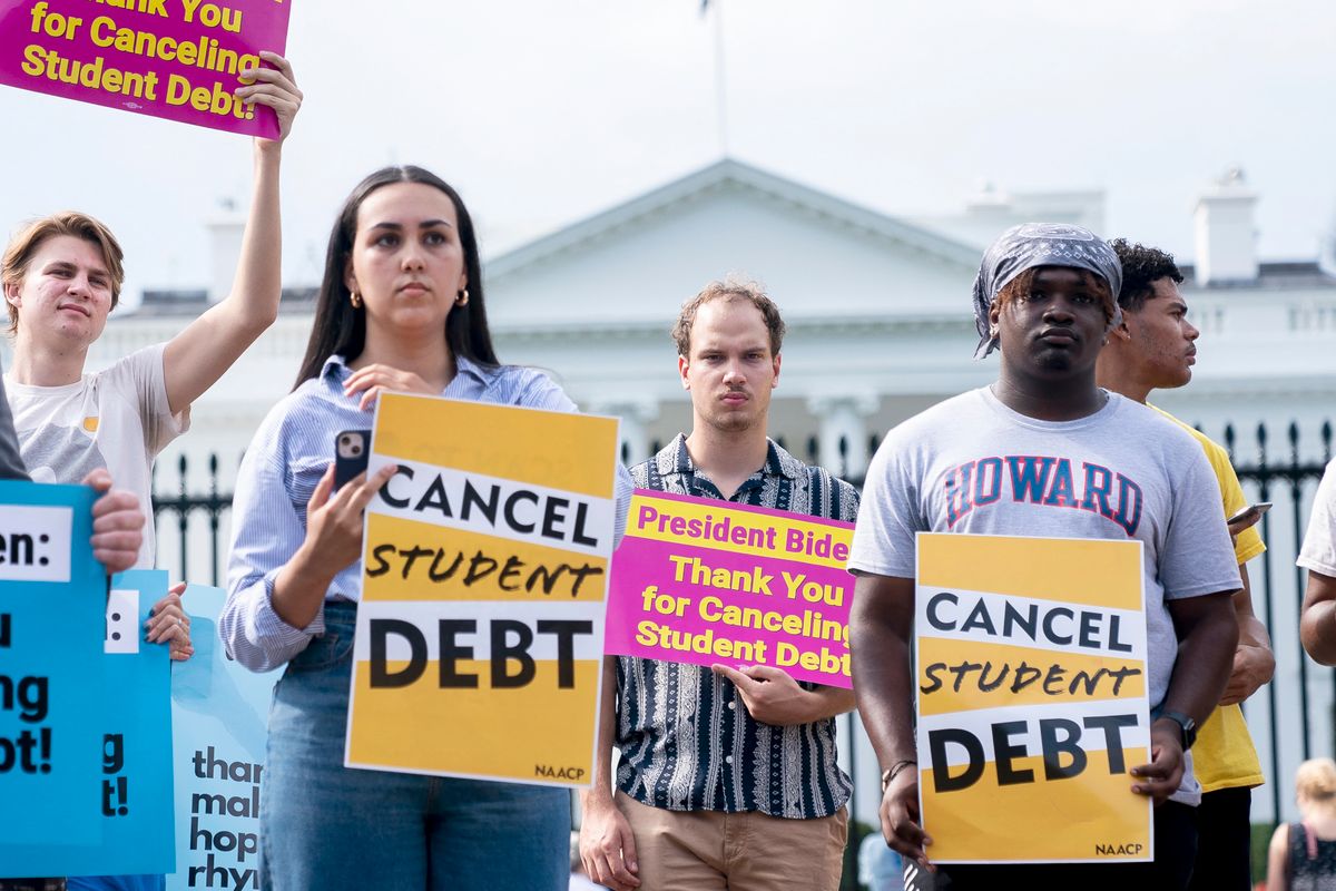 Activists gather to rally in support of cancelling student debt, in front of the White House in Washington, DC, on August 25, 2022. - Biden announced on August 24, 2022, that most US university graduates still trying to pay off student loans will get $10,000 of relief to address a decades-old headache of massive educational debt across the country. (Photo by Stefani Reynolds / AFP) US-POLITICS-BIDEN-EDUCATION-DEBT