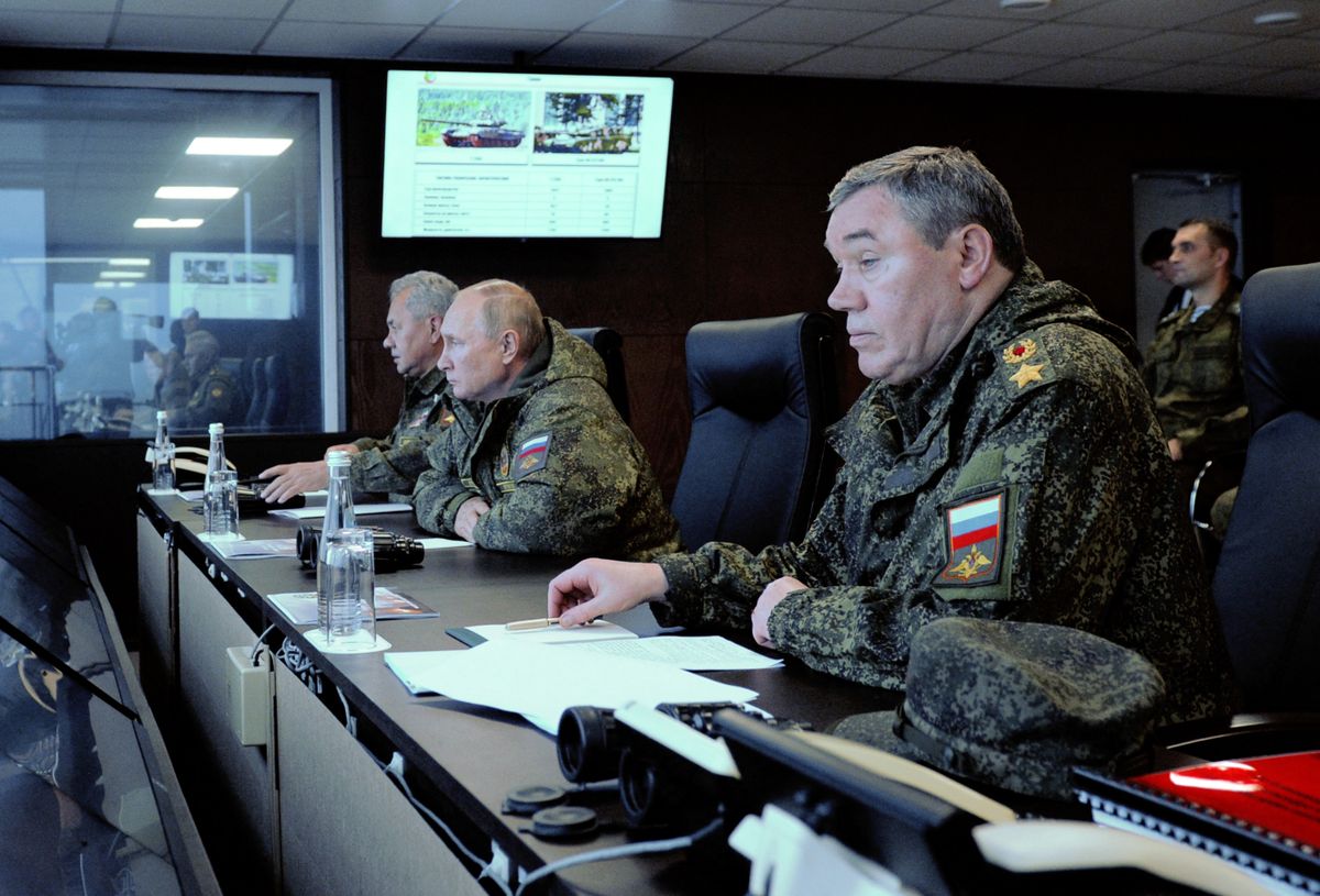 Russian President Vladimir Putin (C), accompanied by Defence Minister Sergei Shoigu (L) and Valery Gerasimov, the chief of the Russian General Staff, oversees the 'Vostok-2022' military exercises at the Sergeevskyi training ground outside the city of Ussuriysk on the Russian Far East on September 6, 2022. - The Vostok 2022 military exercises, involving several Kremlin-friendly countries including China, takes place from September 1-7 across several training grounds in Russia's Far East and in the waters off it. Over 50,000 soldiers and more than 5,000 units of military equipment, including 140 aircraft and 60 ships, are involved in the drills. 