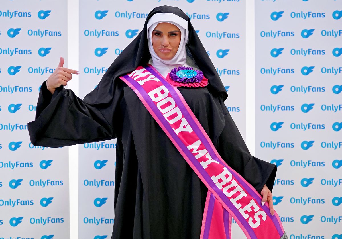 Katie Price dressed as a nun wearing a sash saying "My Body My Rules" during a photocall for her Only Fans website at the Holborn Studios in London. Picture date: Wednesday January 26, 2022.