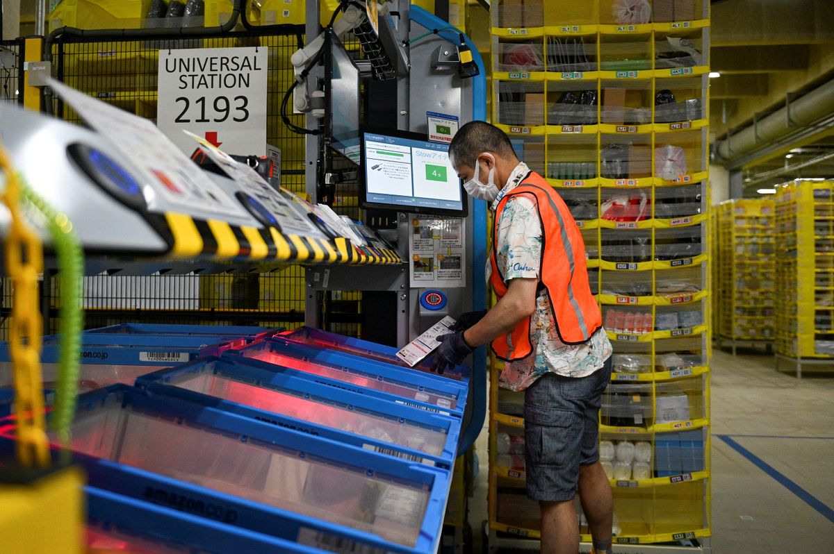 This picture taken on July 4, 2022 shows an employee working at Amazon Amagasaki Fulfillent Center in Amagasaki, Hyogo prefecture. 