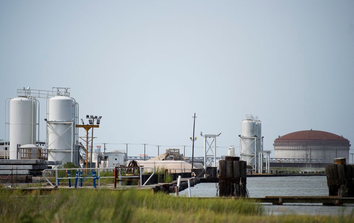 An LNG processing plant is seen in Cameron, Louisiana on August 26, 2020. - Hurricane Laura is due to strengthen to Category 4 before slamming into the US south coast later Wednesday, forecasters said, as residents of coastal Texas and Louisiana were told to evacuate or shelter. With maximum sustained winds currently of 115 miles (185 kilometers) per hour, the hurricane could trigger a storm surge raising water levels by several feet and affecting areas as much as 30 miles inland. 