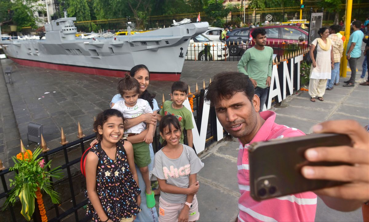 MUMBAI, INDIA  JUNE 12: Family gets their picture infront memorial of INS Vikrant installed at Colaba, on June 12, 2022 in Mumbai, India. 