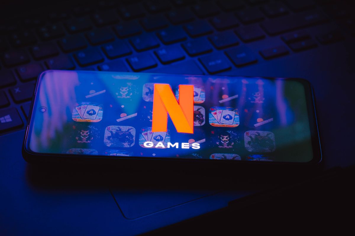 In this photo illustration, the Netflix Games logo seen, BRAZIL - 2021/11/04: In this photo illustration, the Netflix Games logo seen displayed on a smartphone on top of a keyboard. (Photo Illustration by Rafael Henrique/SOPA Images/LightRocket via Getty Images)