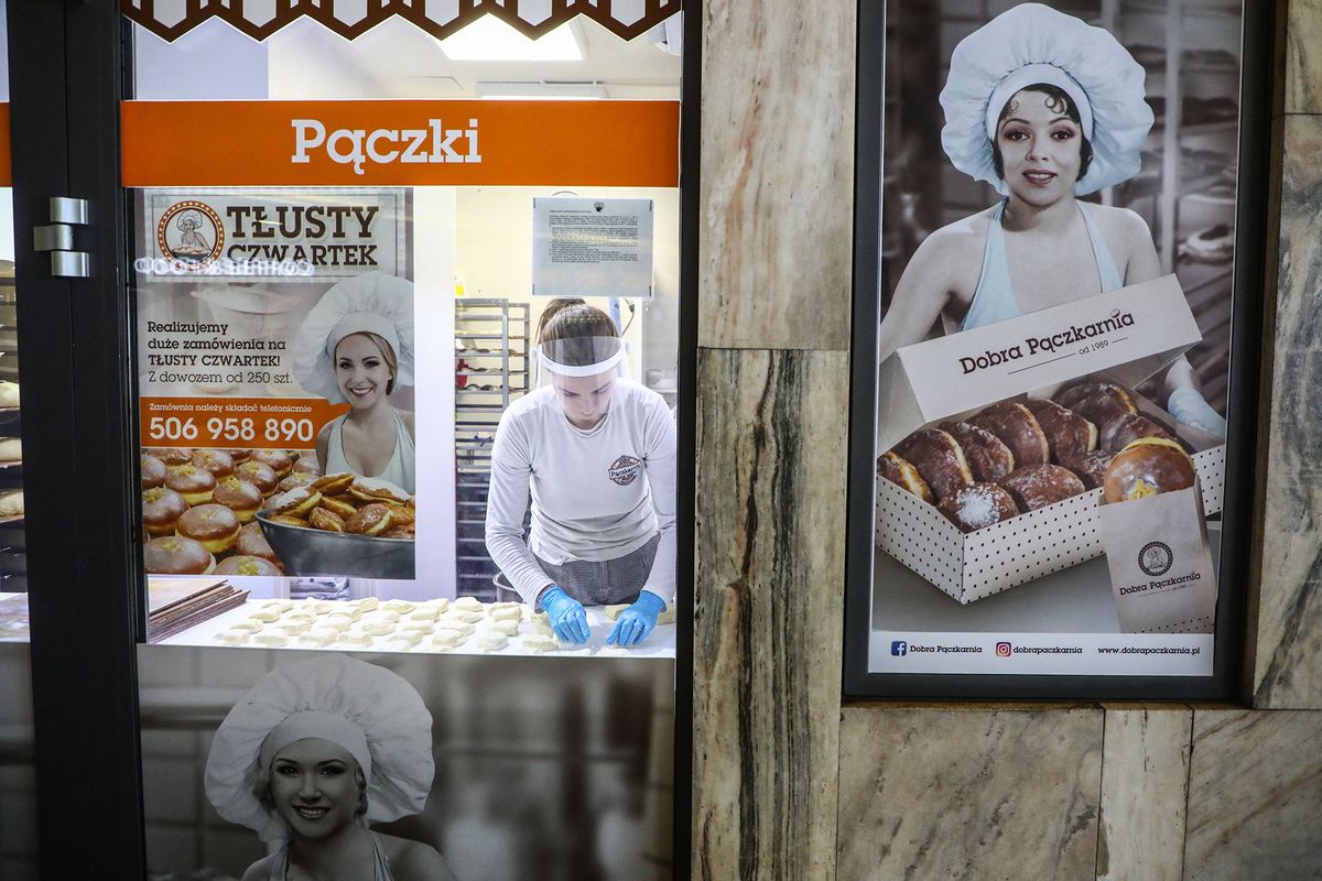Bakery 'Dobra Paczkarnia' produces donuts for Fat Thursday during coronavirus pandemic. Krakow, Poland on Fenruary 10, 2021. Fat Thursday is a traditional Catholic Christian feast on the last Thursday before Lent. It symbolizes the celebration of Carnival. The most popular dish served on that day in Poland are 'paczki' - fist-sized donuts filled with marmalade. (Photo by Beata Zawrzel/NurPhoto) (Photo by Beata Zawrzel / NurPhoto / NurPhoto via AFP)