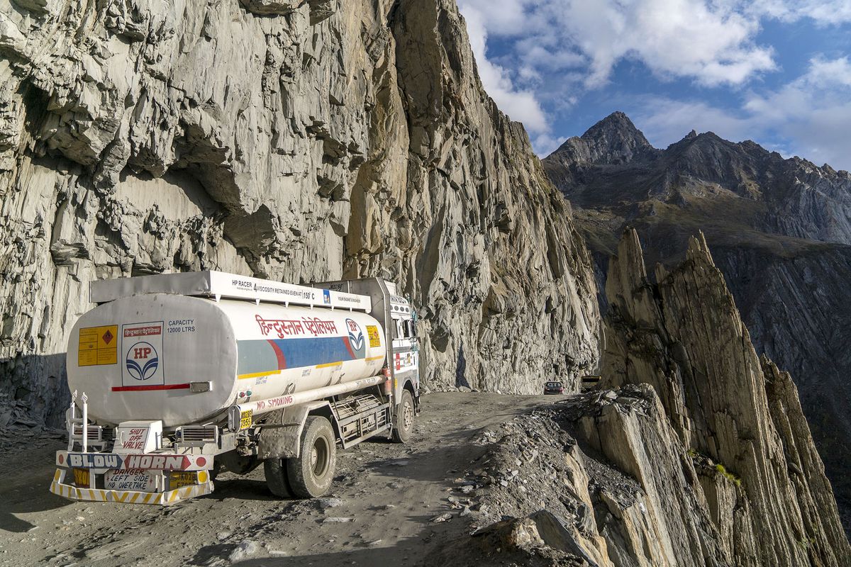 1236800111 Bloomberg Best of the Year 2021: A Hindustan Petroleum Corp. tanker travels round the 'Captain Bend', where the cliff drops off close to 250 meters, on the Zojila mountain pass in Kargil district, the Union Territory of Ladakh, India, on Thursday, Sept. 23, 2021. Photographer: Sumit Dayal/Bloomberg via Getty Images