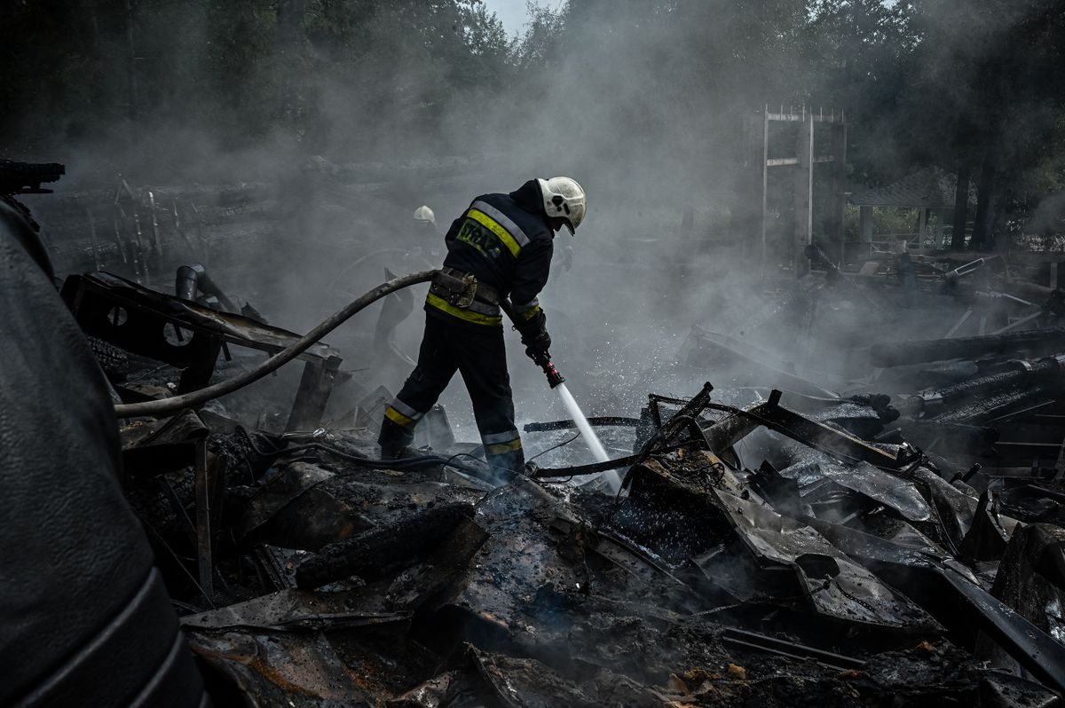 Firefighters douse the rubble of a restaurant complex destroyed by a missile strike in the second largest Ukrainian city of Kharkiv, on September 4, 2022, amid the Russian invasion of Ukraine. 
