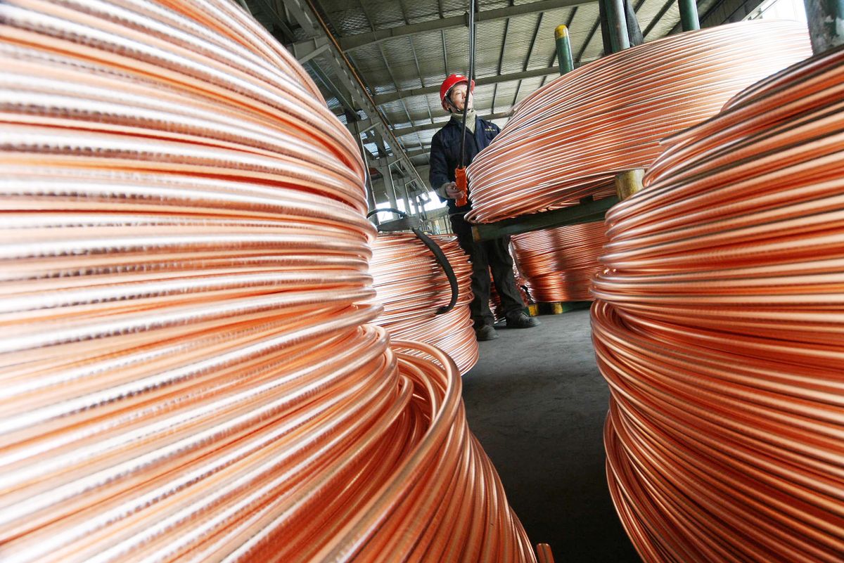 Copper up on China demand view, --FILE--Copper wire rods are pictured at a Copper Plant in Nantong, east Chinas Jiangsu province, 15 February 2011.Copper futures snapped a four-session losing streak on strong economic data out of China, raising expectations that the worlds largest metals consumer will boost imports. The contract for June delivery jumped 12.35 cents, or 3.1%, to $4.1540 a pound on the Comex division of the New York Mercantile Exchange, the highest settlement price since May 31. (Photo by Xu ruiping / Imaginechina / Imaginechina via AFP)
