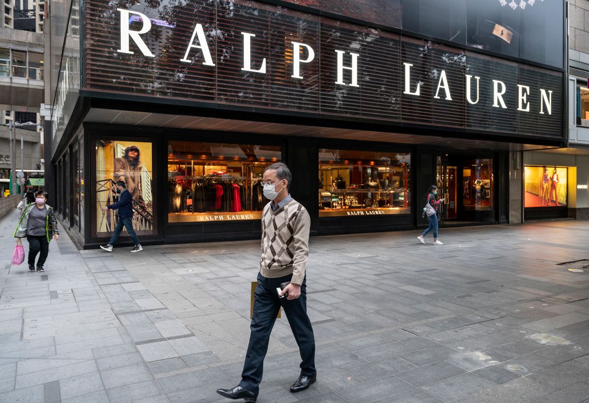 A pedestrian walks past the American fashion brand Ralph