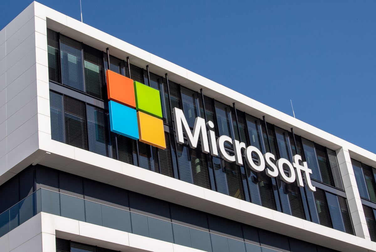 Microsoft logo, 26 March 2021, Bavaria, Munich: The Microsoft logo hangs on the facade of an office building in Parkstadt Schwabing, in the north of the Bavarian capital. Photo: Peter Kneffel/dpa (Photo by Peter Kneffel/picture alliance via Getty Images)