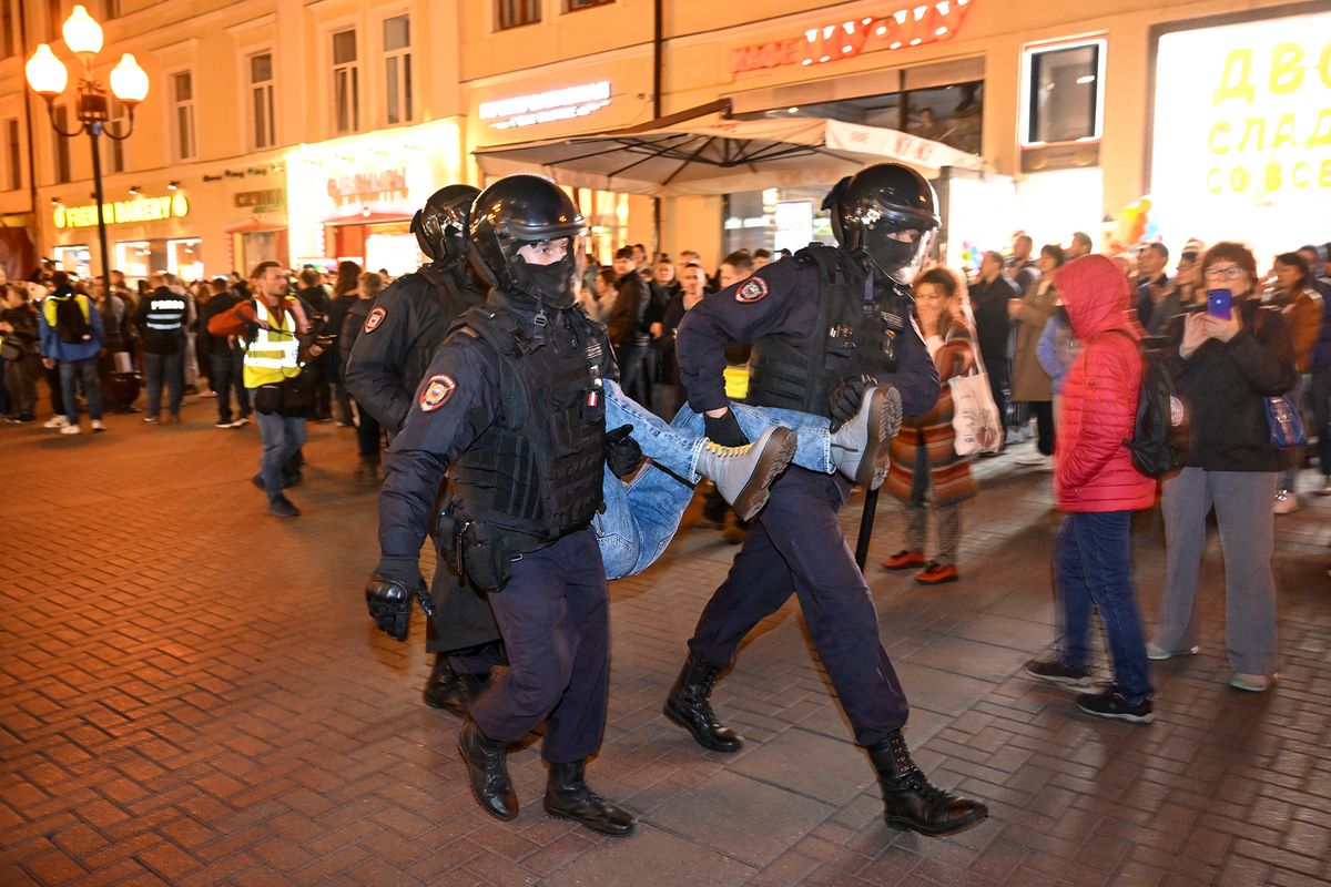 Police officers detain a person in Moscow on September 21, 2022