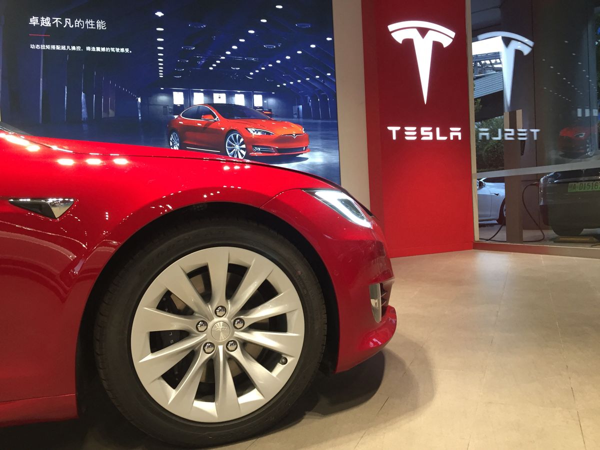 --FILE--View of a Tesla store in Shanghai, China, 27 October 2018.American electric carmaker Tesla, which is building its first overseas factory in Shanghai, is once again recruiting staff as it looks to speed up construction of the Chinese plant. The California-based firm is looking to fill 30 posts including factory and construction-related positions and administrative support roles, it said in a statement on WeChat. Some of the vacancies include construction safety engineers, purchasing managers and recruitment consultants. Tesla has been accelerating construction of the new Gigafactory after the success of its Model 3 -- its least expensive model but biggest income generator -- in North America. It began hiring staff to build the plant in August and extended its recruitment in October. (Photo by Sun xinming / Imaginechina / Imaginechina via AFP)