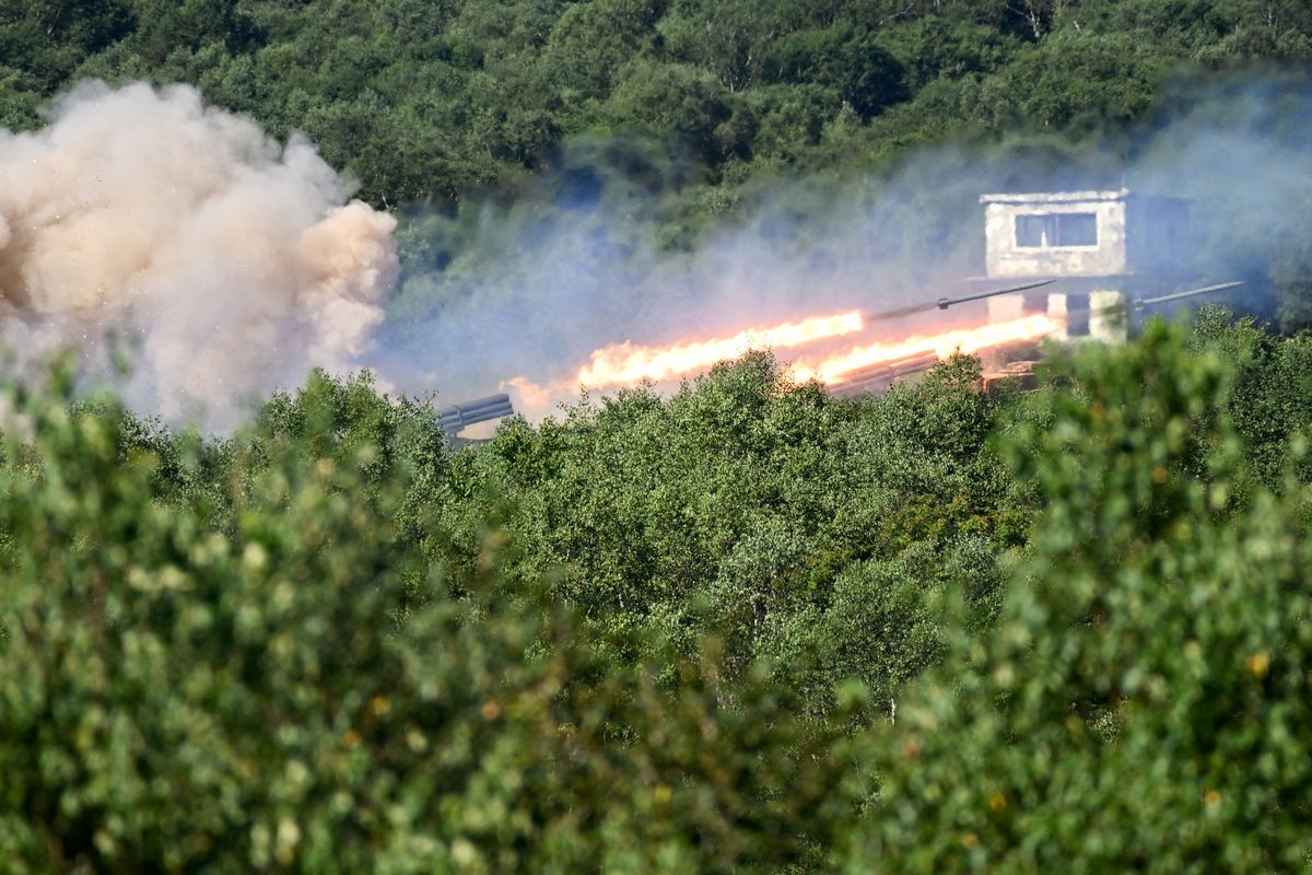 Russian Uragan self-propelled 220mm multiple rocket launchers fire projectiles in the 'Vostok-2022' military exercises at the Uspenovskyi training ground (Sakhalin Island) outside the city of Yuzhno-Sakhalinsk on the Russian Far East on September 4, 2022. - The Vostok 2022 military exercises, involving several Kremlin-friendly countries including China, takes place from September 1-7 across several training grounds in Russia's Far East and in the waters off it. Over 50,000 soldiers and more than 5,000 units of military equipment, including 140 aircraft and 60 ships, are involved in the drills. (Photo by Kirill KUDRYAVTSEV / AFP)