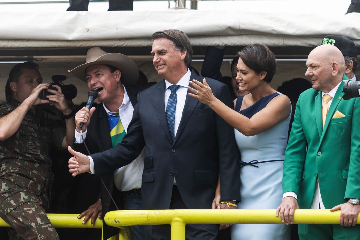 President Bolsonaro Attends Military Parade On Brazil's Independence Day, Jair Bolsonaro, Brazil's president, and First Lady Michelle Bolsonaro during an Independence Day military parade in Brasilia, Brazil, on Wednesday, Sept. 7, 2022. Around 10,000 police officers have been deployed to prevent riots in Brasilia, where Bolsonaro supporters will hold pro-government rallies following an Independence Day military parade. Photographer: Arthur Menescal/Bloomberg via Getty Images