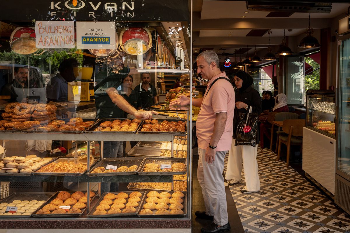 Customers inside a bakery in the Sisli district of Istanbul, Turkey, on Monday, Aug. 29, 2022. Turkeys central bank delivered a shock cut to interest rates despite inflation soaring to a 24-year high and the lira trading near a record low. 
