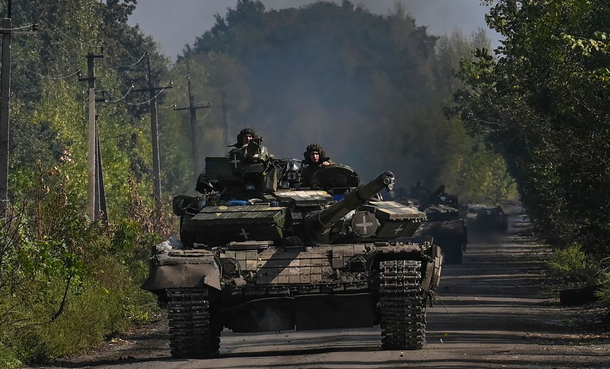 Ukrainian soldiers ride a tank in Novoselivka, on September 17, 2022, as the Russia-Ukraine war enters its 206th day.