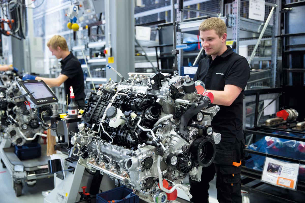 Engineer at work hand-building one complete M157 5.5L V8 biturbo engine, Mercedes-AMG engine production factory in Affalterbach, Bavaria, Germany, Europe, Engineer at work hand-building one complete M157 5.5L V8 biturbo engine, Mercedes-AMG engine production factory in Affalterbach, Bavaria, Germany, Europe (Photo by TIM GRAHAM / Robert Harding Heritage / robertharding via AFP)