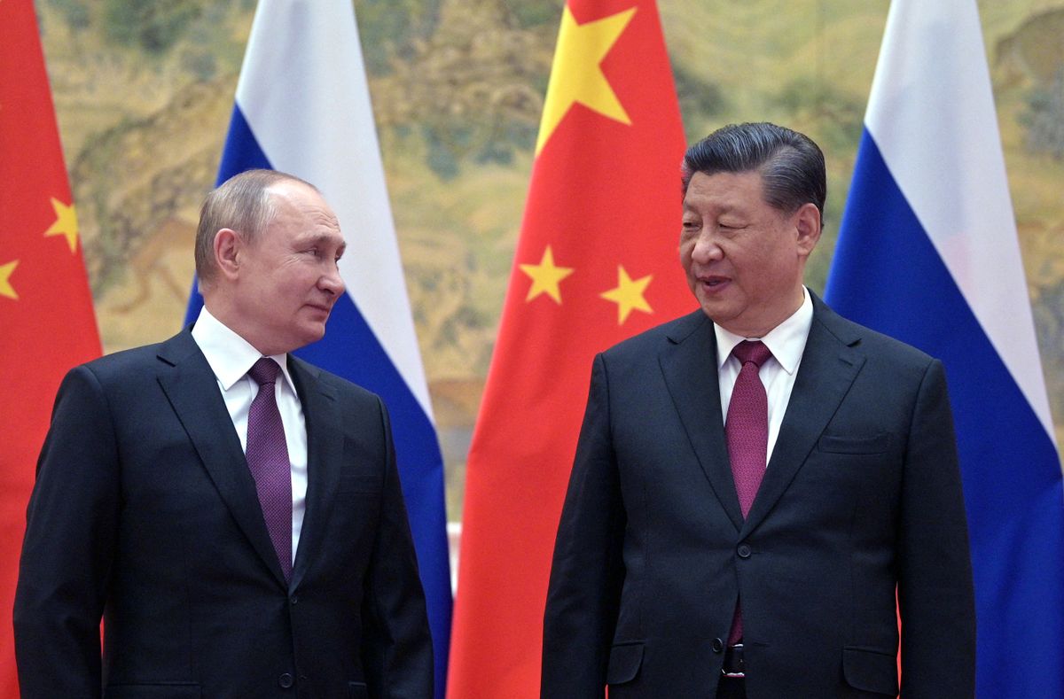 TOPSHOT - Russian President Vladimir Putin (L) and Chinese President Xi Jinping pose for a photograph during their meeting in Beijing, on February 4, 2022. 