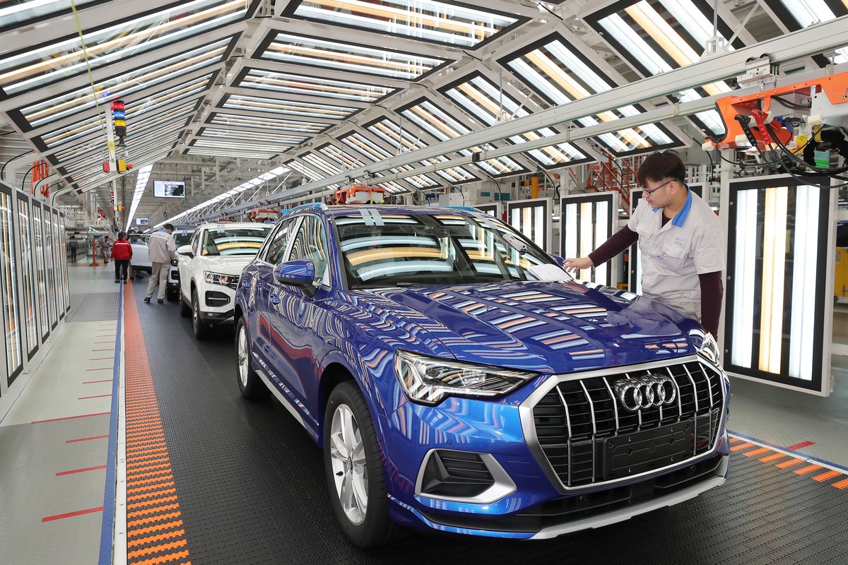 Whole-vehicle Manufacturing Base Of FAW-Volkswagen In Tianjin, TIANJIN, CHINA - DECEMBER 05: Employees work on the assembly line of Audi Q3 at a whole-vehicle manufacturing base of the Sino-German joint venture FAW-Volkswagen Automotive Co Ltd on December 5, 2019 in Tianjin, China. Volkswagen Group China and its partners will invest over 4 billion euros in China in 2020. (Photo by VCG/VCG via Getty Images)
