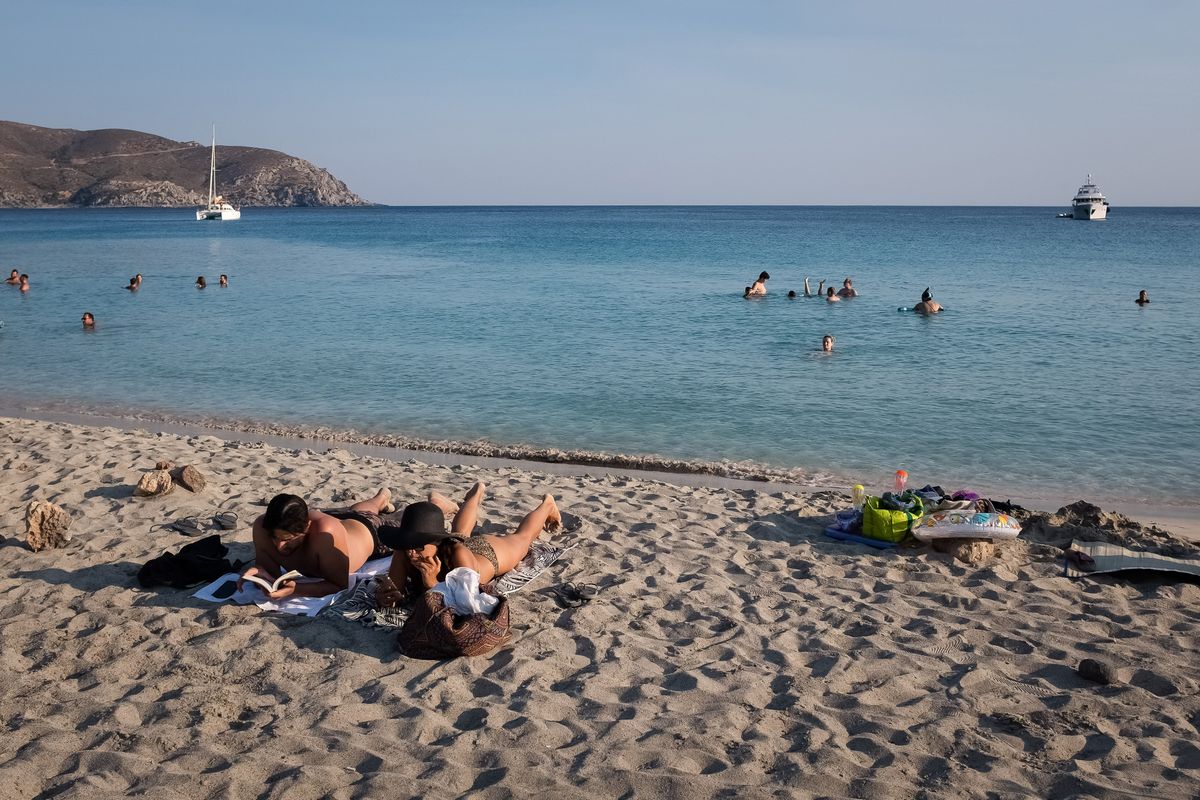 Tourism In Greece - Kedrodasos Beach In Crete Island, People enjoy their time at Cedar Forest (Kedrodasos) beach in Chania, Crete Island, Greece on August 18, 2022. (Photo by Nikolas Kokovlis/NurPhoto) (Photo by Nikolas Kokovlis / NurPhoto / NurPhoto via AFP)