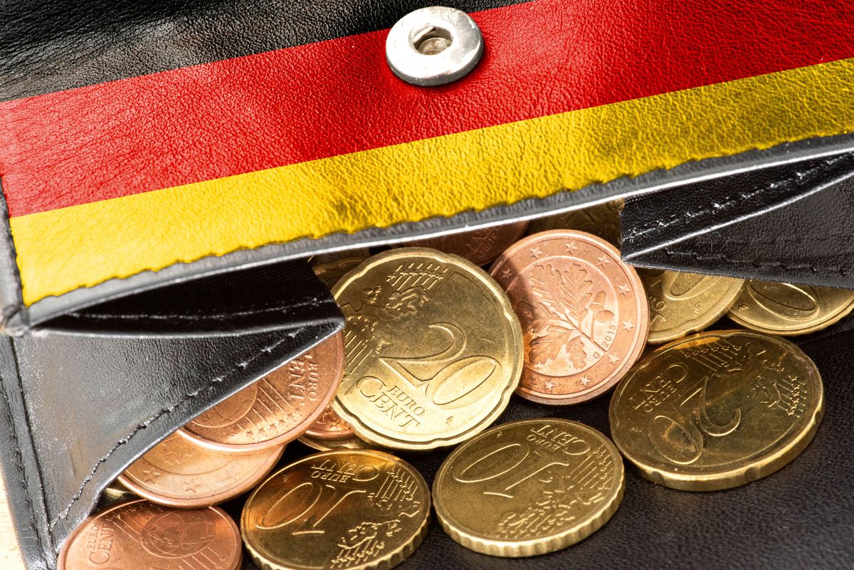 A,Purse,With,A,German,Flag,And,Many,Euro,Coins, A purse with a German flag and many euro coins, A purse with a German flag and many euro coins