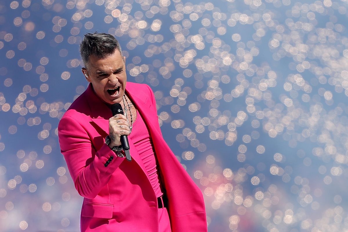 MELBOURNE, AUSTRALIA - SEPTEMBER 24: Robbie Williams performs during the 2022 Toyota AFL Grand Final match between the Geelong Cats and the Sydney Swans at the Melbourne Cricket Ground on September 24, 2022 in Melbourne, Australia.