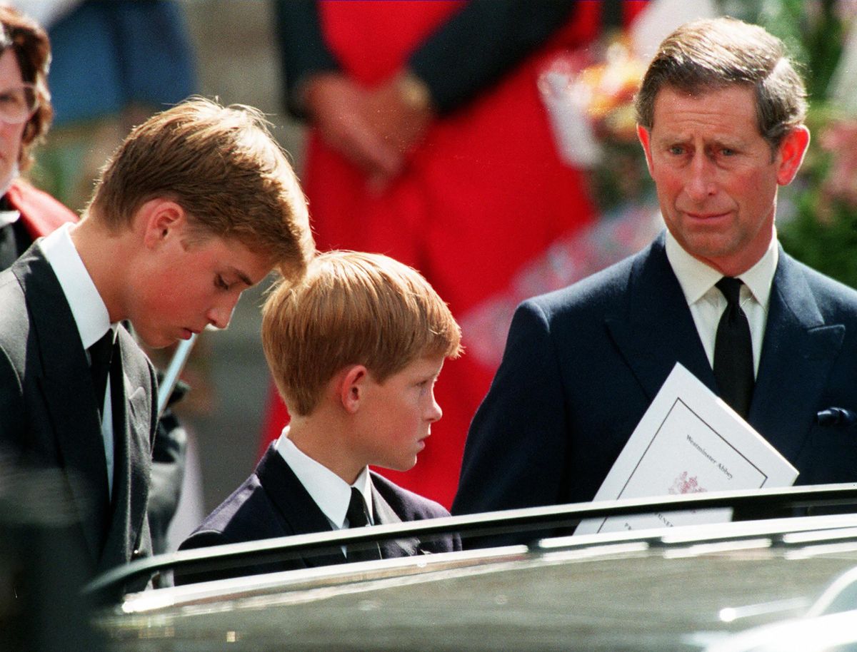 (FILES) In this file photo taken on September 6, 1997 Former husband of Diana, Prince Charles (R) and their two sons Harry (C) and William (L) wait in front of the Westminster Abbey in London after the funeral ceremony of Princess of Wales. - Princes William and Harry will on August 31, 2022 mark the 25th anniversary of the death of their mother Princess Diana, in private but apart as a feud between the brothers shows no sign of ending. The former Lady Diana Spencer, whose fairytale marriage to Prince Charles captivated the world until it publicly unravelled with infidelity and divorce, died in a car crash on August 31, 1997. 