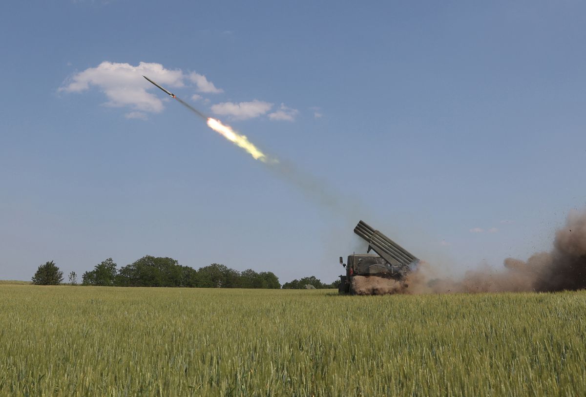 This photograph taken on June 11, 2022 shows a Ukrainian BM-21 Grad, a multiple rocket launcher, firing near Izyum, south of Kharkiv, amid Russian invasion of Ukraine. (Photo by Anatolii STEPANOV / AFP)
