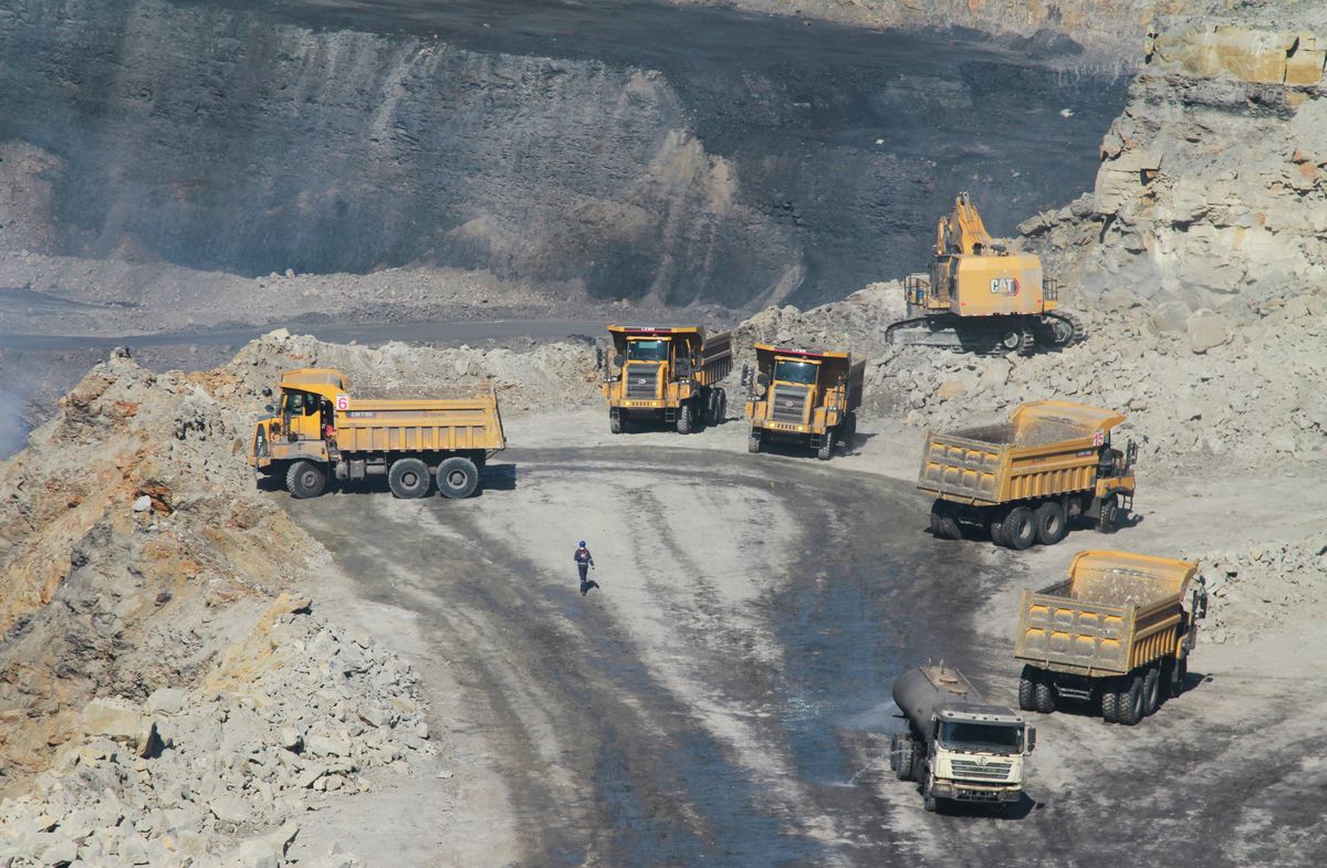 ZIMBABWE-HWANGE-CHINESE INVESTMENT, (220702) -- HWANGE, July 2, 2022 (Xinhua) -- Engineering vehicles are seen at an open cast mine operated by Zhong Jian Investments, a Chinese coal mining company, in Hwange, Matebeleland North Province, Zimbabwe, on June 13, 2022. Zimbabwe is witnessing an influx of Chinese investments in the mining sector, as the resource-rich southern African country seeks to increase mineral production and maximize beneficiation in order to get better returns from its vast mineral wealth.   TO GO WITH "Chinese investments give new impetus to Zimbabwe's mining sector growth" (Photo by Tafara Mugwara/Xinhua) (Photo by Tafara Mugwara / XINHUA / Xinhua via AFP)