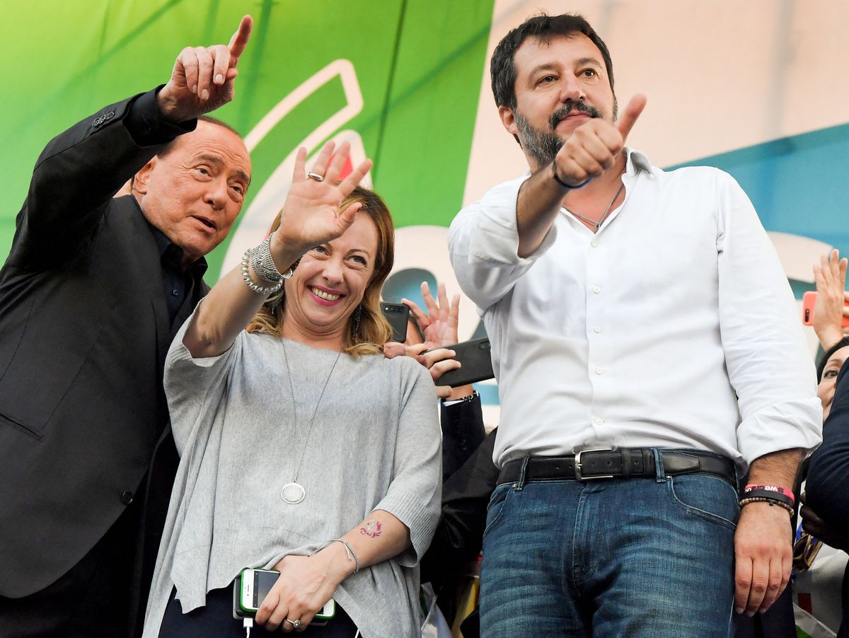 (From L) Leader of Italy's liberal-conservative party Forza Italia, Silvio Berlusconi, leader of Italy's conservative party Brothers of Italy, Giorgia Meloni and leader of Italy's far-right League party, Matteo Salvini acknowledge supporters at the end of a joint rally against the government on October 19, 2019 in Rome. - Italy's strongman Matteo Salvini holds a key rally in Rome on October 19 aimed at re-launching the Italian right and making a power-grab for the capital. Some eight special trains and 400 coaches transported supporters from across the country for the "Italian Pride" demonstration. (Photo by Tiziana FABI / AFP)