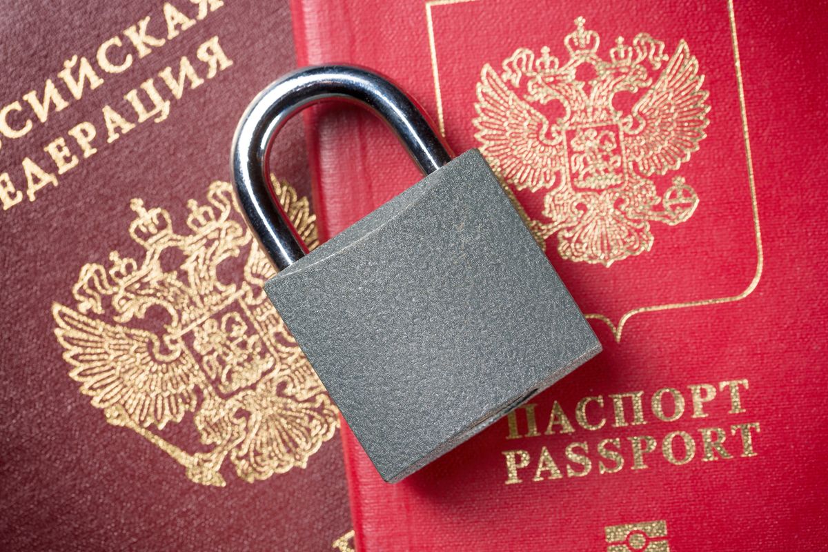 Russia Sanctions and Ukraine war concept. Russian Federation passports with padlock.