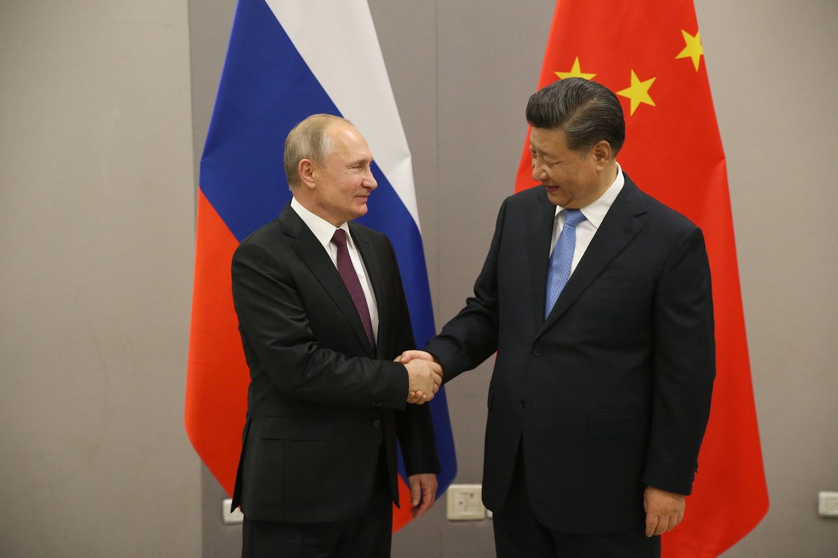 Russian President Vladimir Putin meets Chinese President Xi Jinping at BRICS Summit in Brasilia BRASILIA, BRAZIL - NOVEMBER 13: (RUSSIA OUT) Russian President Vladimir Putin (L) greets Chinese President Xi Jinping (R) during their bilateral meeting on November 13, 2019 in Brasilia, Brazil. The leaders of Russia, China, Brazil, India and South Africa have gathered in Brasilia for the BRICS leaders summit. (Photo by Mikhail Svetlov/Getty Images)